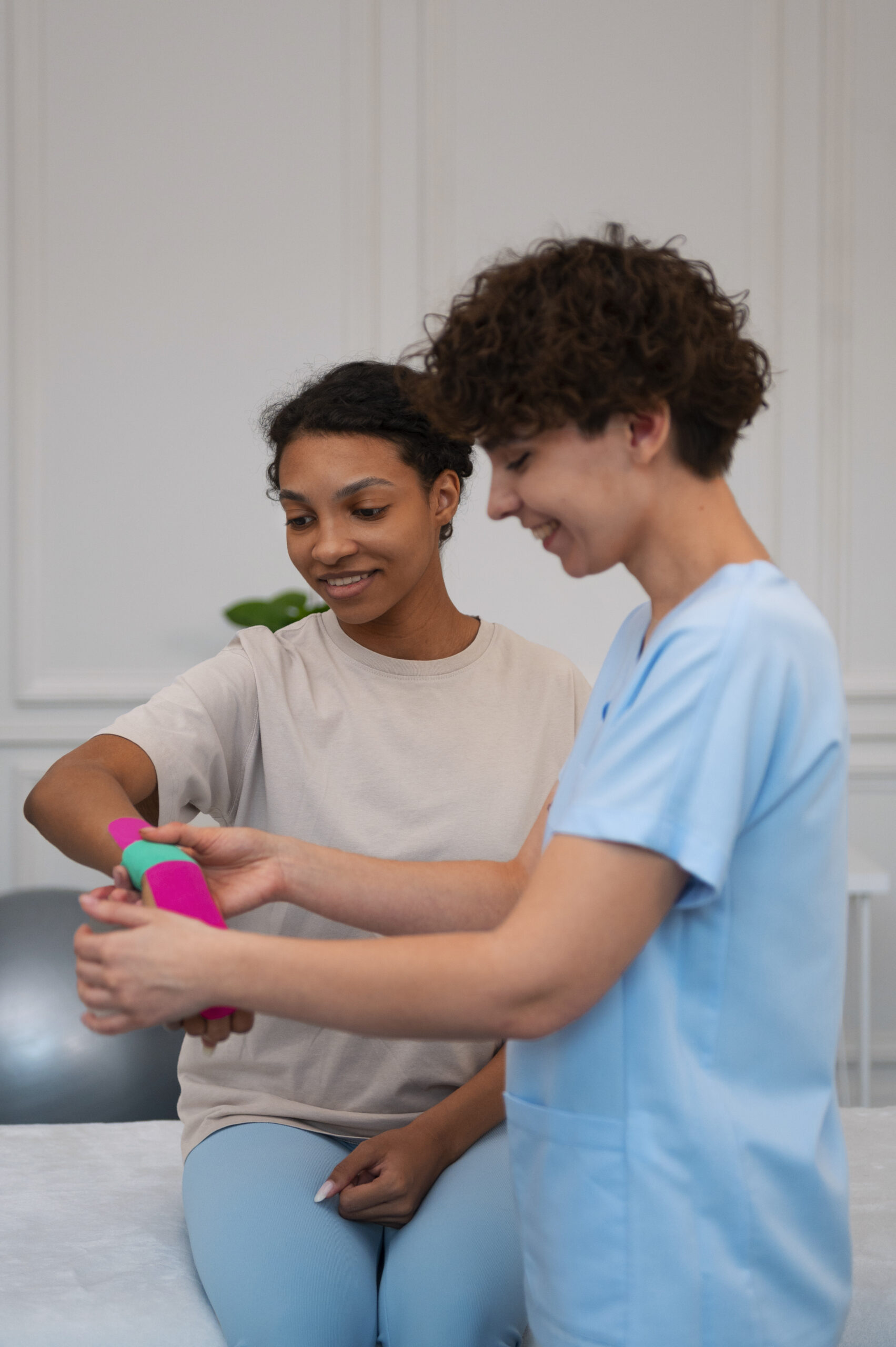 Woman receiving wrist support in rehabilitation at HealzHer by Dr. Marya Asgher